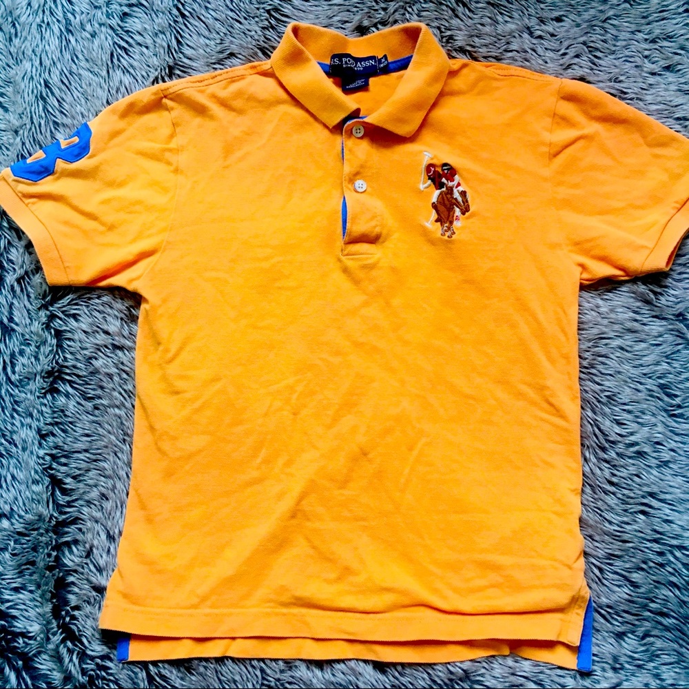 U.S.POLO ASSN. boy’s orange color blue logo  polo Tshirt size medium 10/12